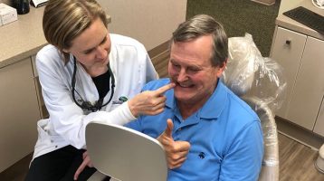 Dr. Robinson pointing Dr. Cranford Dental Work