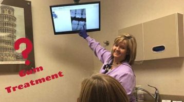Hygienist explaining gum treatment