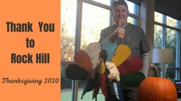 Dr. Cranford thanking Rock Hill with tin turkey and pumpkiin